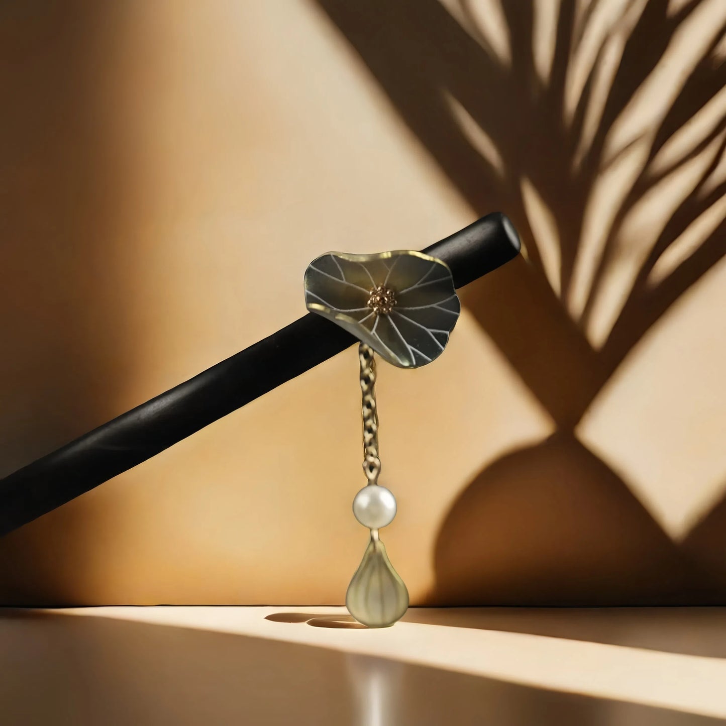 The TAOÉ Endless Lotus Luck Silver Hairpin by Double the blessings shines with crystal dewdrops, evoking handcrafted Chinese elegance as soft sunlight casts leaf shadows on a beige backdrop. Enjoy 50% off the 2nd item.