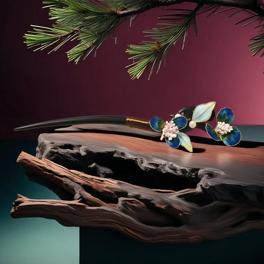 The Book of Songs Collections TAOÉ New Chinese Style Ronghua Hairstick in Ebony—Intangible Heritage Bloom-Elegantiae-Amethyst Petal—rests on dark wood with floral ornaments and pine branches, radiating elegant, divine aesthetics.