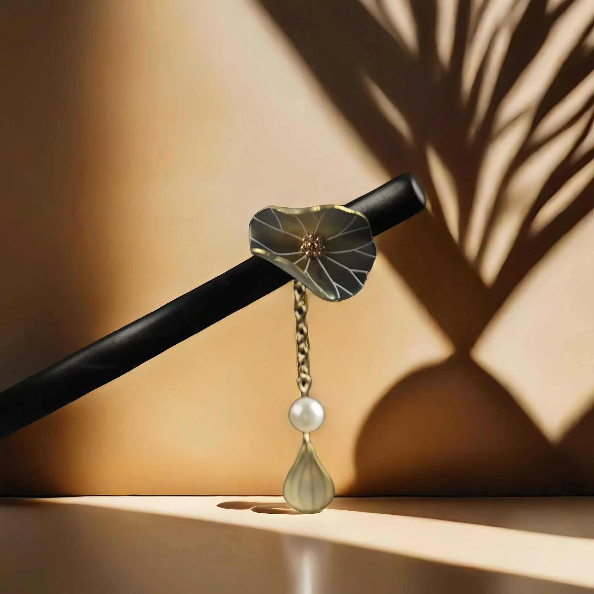 The TAOÉ Endless Lotus Luck Silver Hairpin by Double the blessings shines with crystal dewdrops, evoking handcrafted Chinese elegance as soft sunlight casts leaf shadows on a beige backdrop. Enjoy 50% off the 2nd item.
